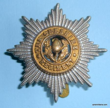 The Cheshire Regiment Bi-Metal Cap Badge - maker marked, sweat holes