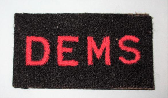 WW2 DEMS Embroidered Red on Black Cloth Sleeve Badge