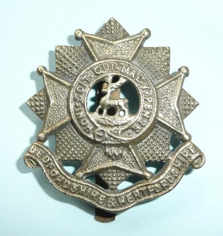 WW2 Sand Cast Theatre Made Bedfordshire & Hertfordshire Regiment White Metal Cap Badge - G. Karrenjee & Sons, Aligarh U.P.