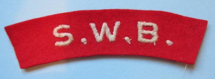 SWB ( South Wales Borderers ) Embroidered White on Red Felt Cloth Shoulder Title, worn 1943