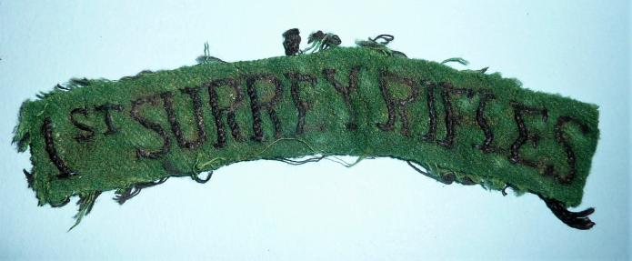 An Early 1st Surrey Rifles Black on Green Embroidered Shoulder Title