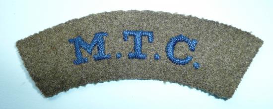 WW2 Mechanised Transport Corps (MTC) Cloth Shoulder Title, blue embroidered lettering on khaki