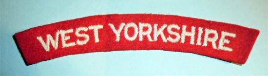 WW2 West Yorkshire Regiment Embroidered White on Red Felt Cloth Shoulder Title