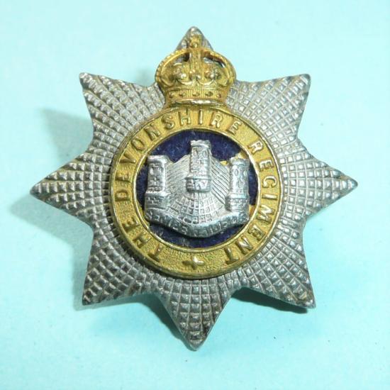 Devonshire Regiment Officers Silver Plated Gilt and Blue Velvet Collar Badge. King's Crown