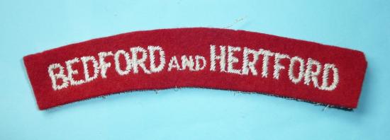 Bedford and Hertford Regiment Embroidered White on Red Felt Cloth Shoulder Title (Type 3)