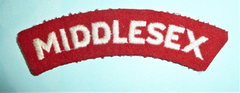 Middlesex Regiment Embroidered White on Red Felt Cloth Shoulder Title