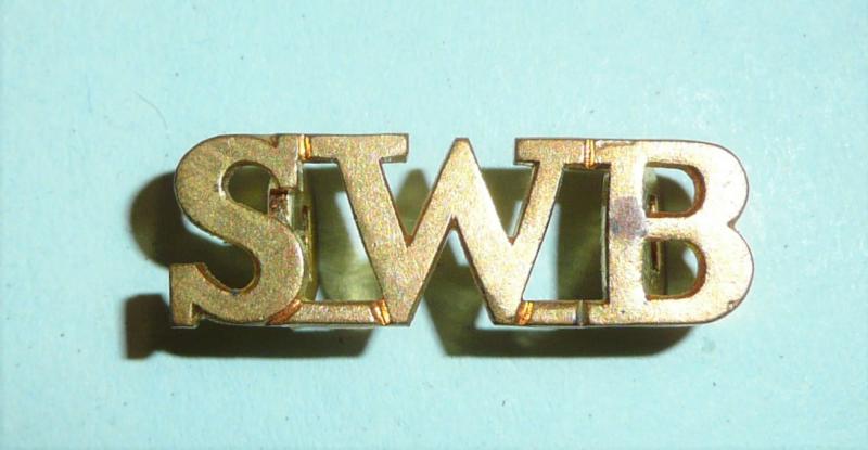 South Wales Borderers (SWB) small gilt brass officers pattern shoulder title