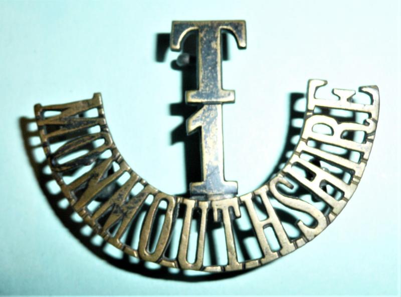 T / 1 / Monmouthshire Blackened Brass One Piece Shoulder Title