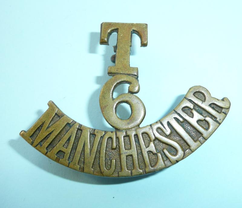 WW1 T / 6 / Manchester Regiment One Piece Unvoided Brass Shoulder Title