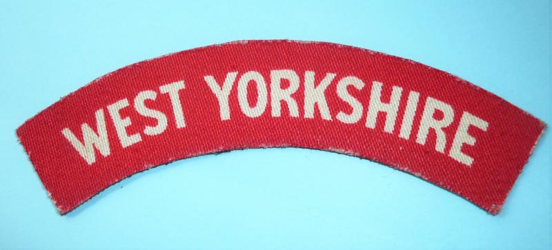 WW2 West Yorkshire Regiment Printed Red on White Cloth Shoulder Title