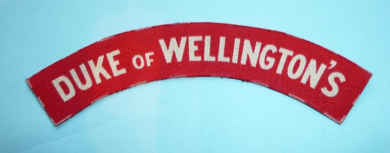 Duke of Wellington's (West Riding Regiment) Printed White on Red Cloth Shoulder Title