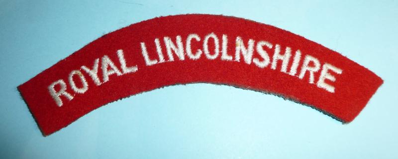 Royal Lincolnshire Regiment Embroidered White on Red Felt Cloth Shoulder Title