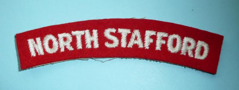 The Prince of Wales's North Staffordshire Regiment Woven White on Red Felt Cloth Shoulder Title