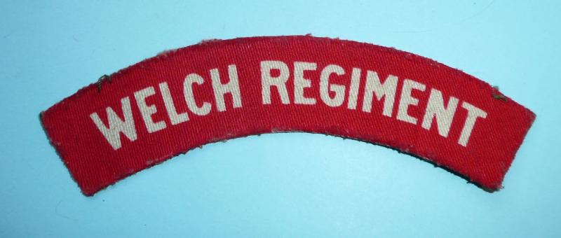 WW2 Welch Regiment Printed White on Red Ordnance Issue Cloth Shoulder Title