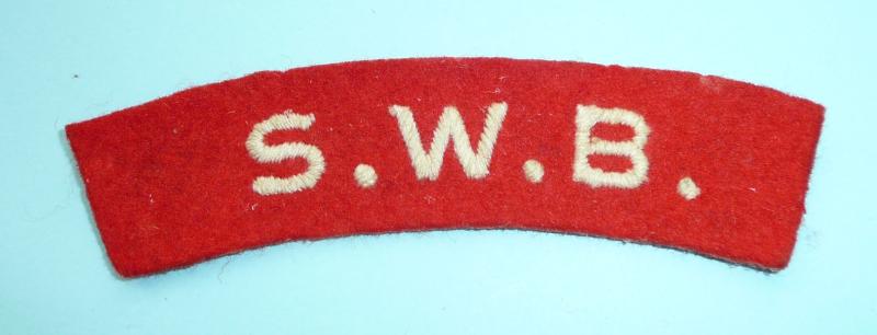 WW2 SWB (South Wales Borderers) White on Red Woven Enbroidered Felt Cloth Shoulder Title